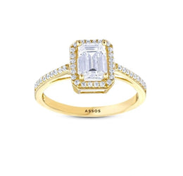 Диамантен пръстен с централен багетен и кръгли диаманти