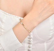 Твърда златна гривна Wave